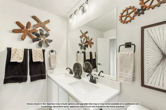 a bathroom with a sink vanity and mirror