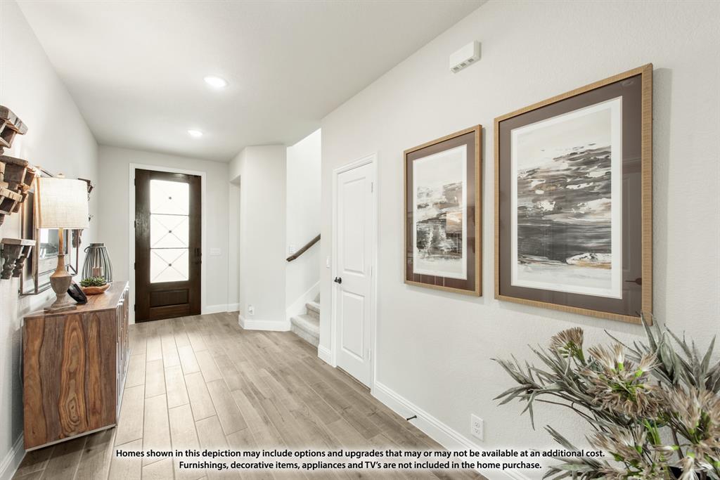1108 Edgemire Lane Aubrey, TX 76227 - Photo 4 of 34 a view of a living room and a wooden floor
