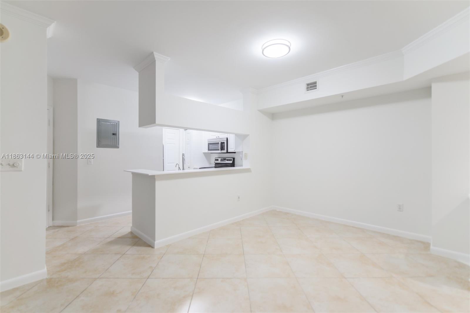 17100 North Bay Road, Unit 1303 Sunny Isles Beach, FL 33160 - Photo 15 of 24 wooden floor in an empty room with a window