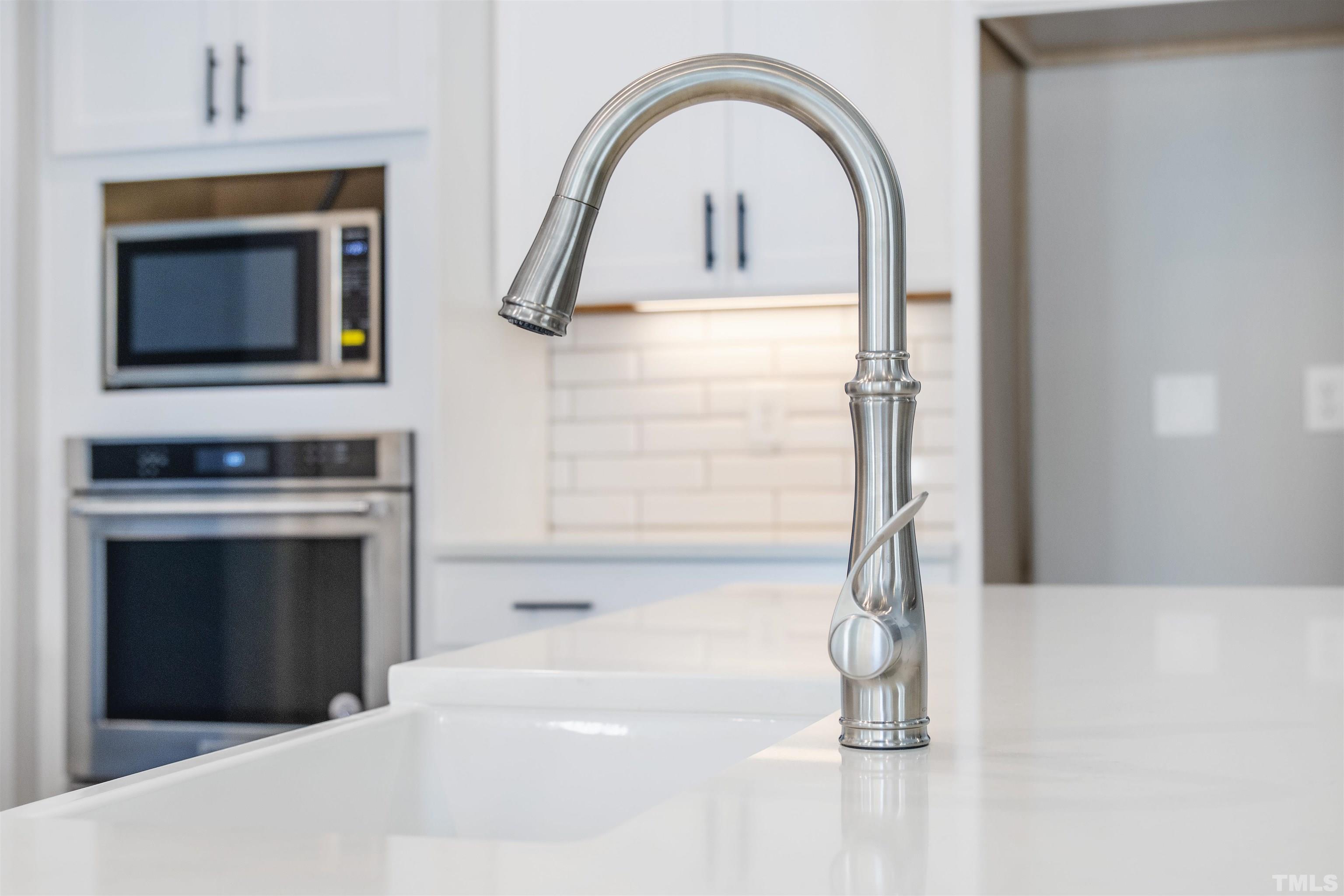 4013 Wilton Woods Place Cary, NC 27519 - Photo 15 of 30 a living room with a fireplace and a flat screen tv