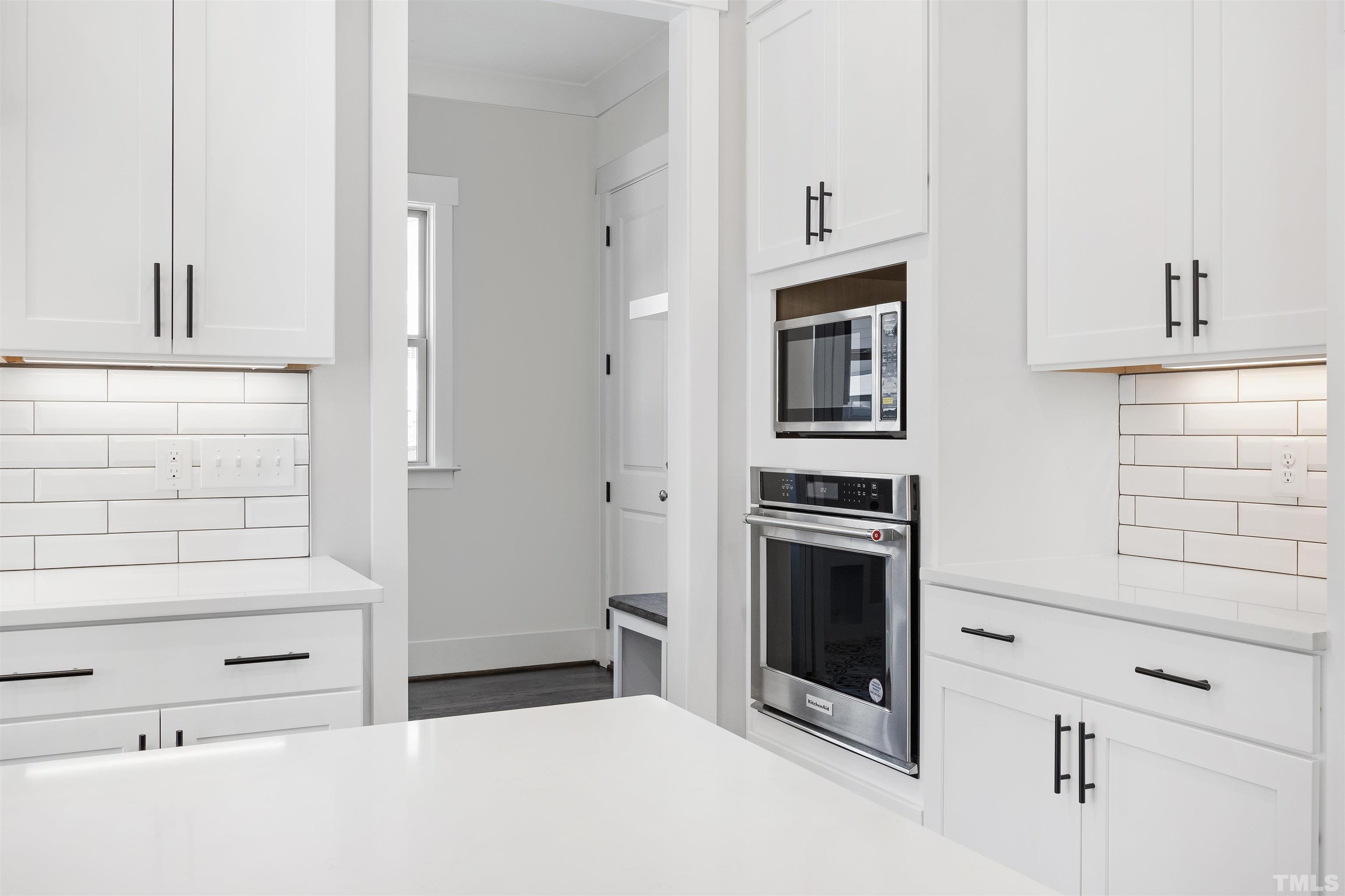 4013 Wilton Woods Place Cary, NC 27519 - Photo 16 of 30 a bathroom with a double vanity sink and a mirror