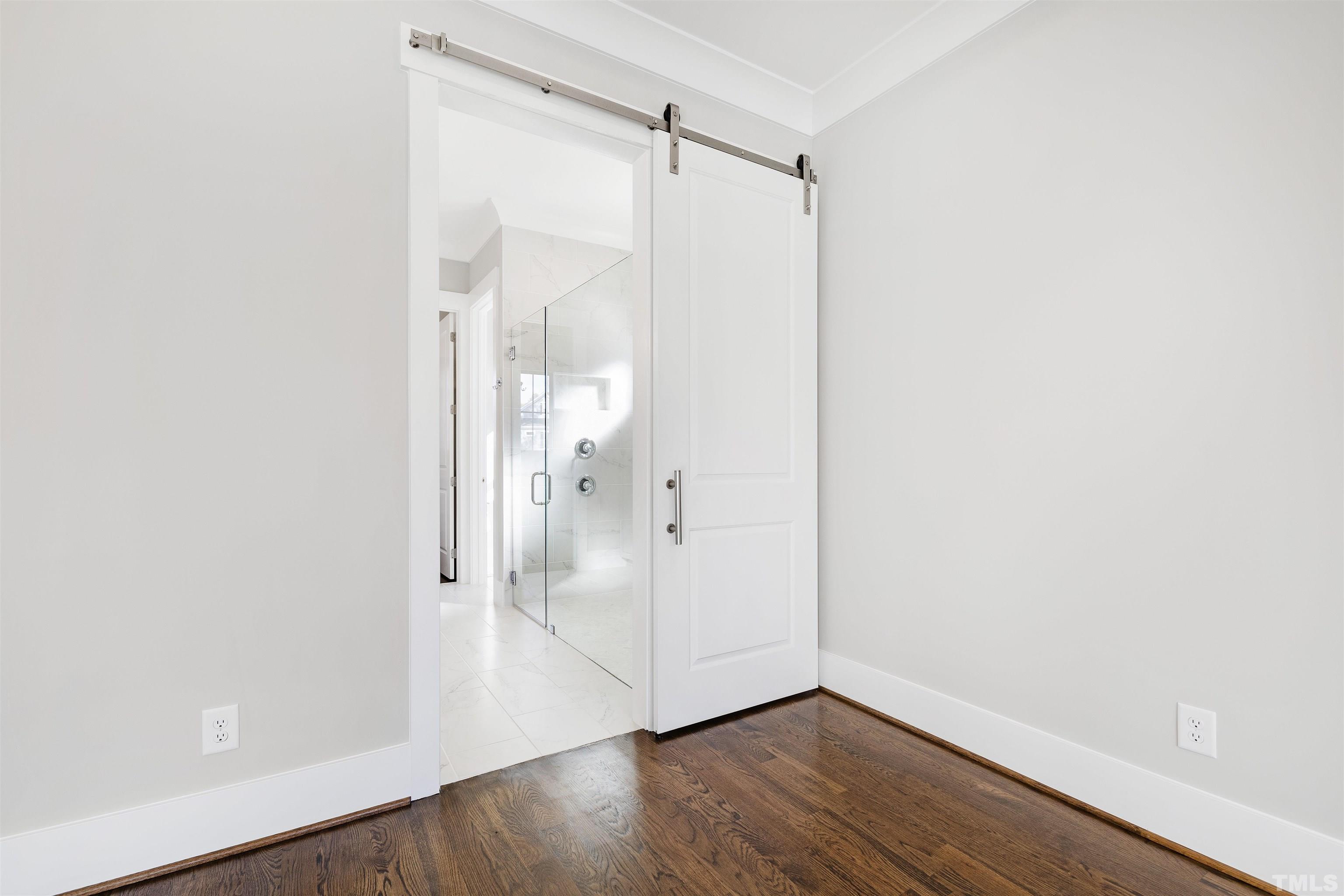4013 Wilton Woods Place Cary, NC 27519 - Photo 22 of 30 a view of a hallway with wooden floor