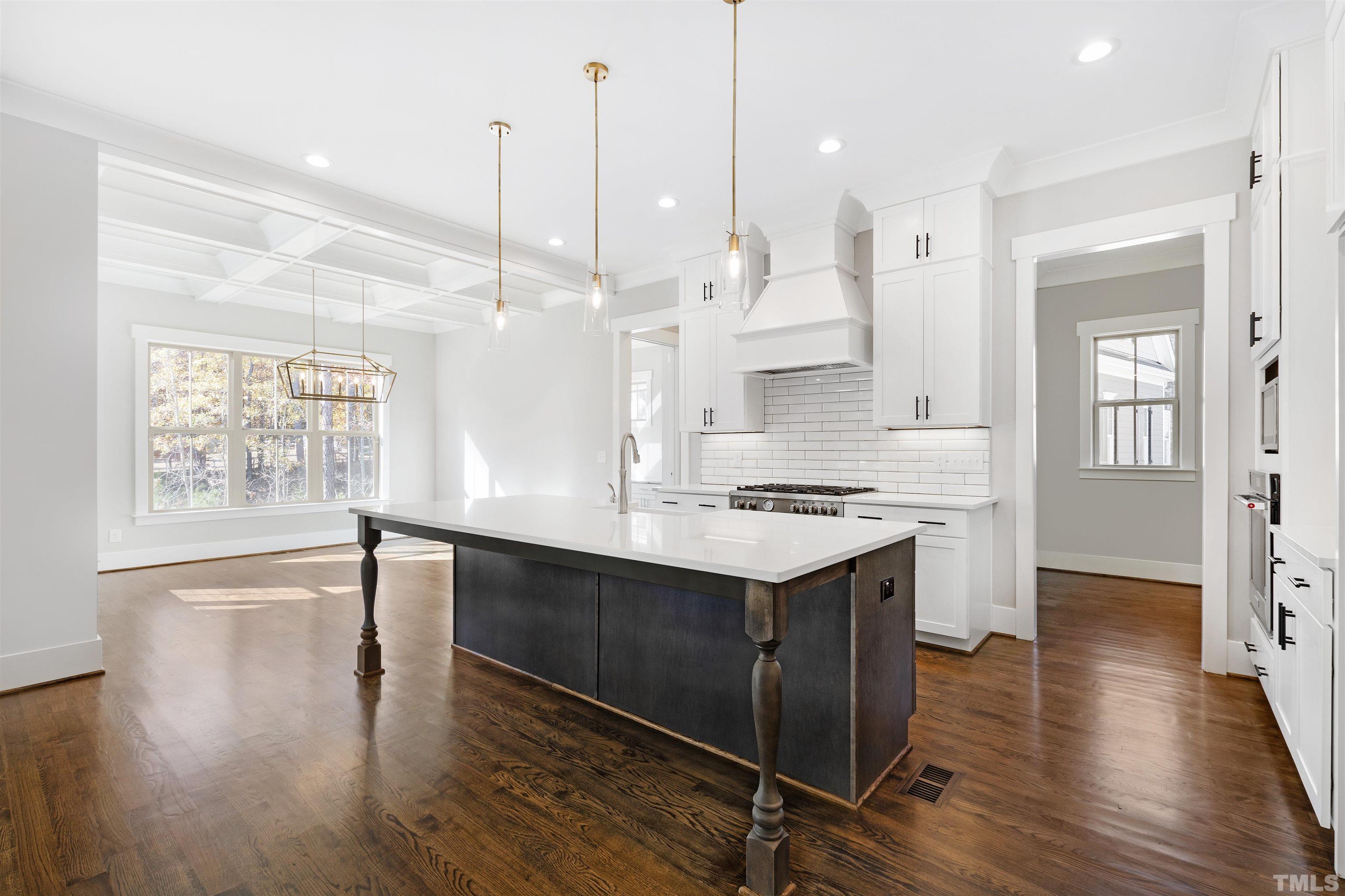 4013 Wilton Woods Place Cary, NC 27519 - Photo 3 of 30 a large kitchen with lots of counter space a sink appliances and a large window