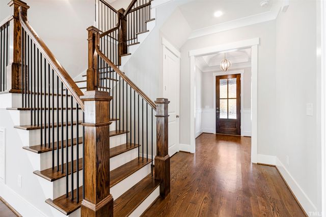 a view of staircase with white walls and a window