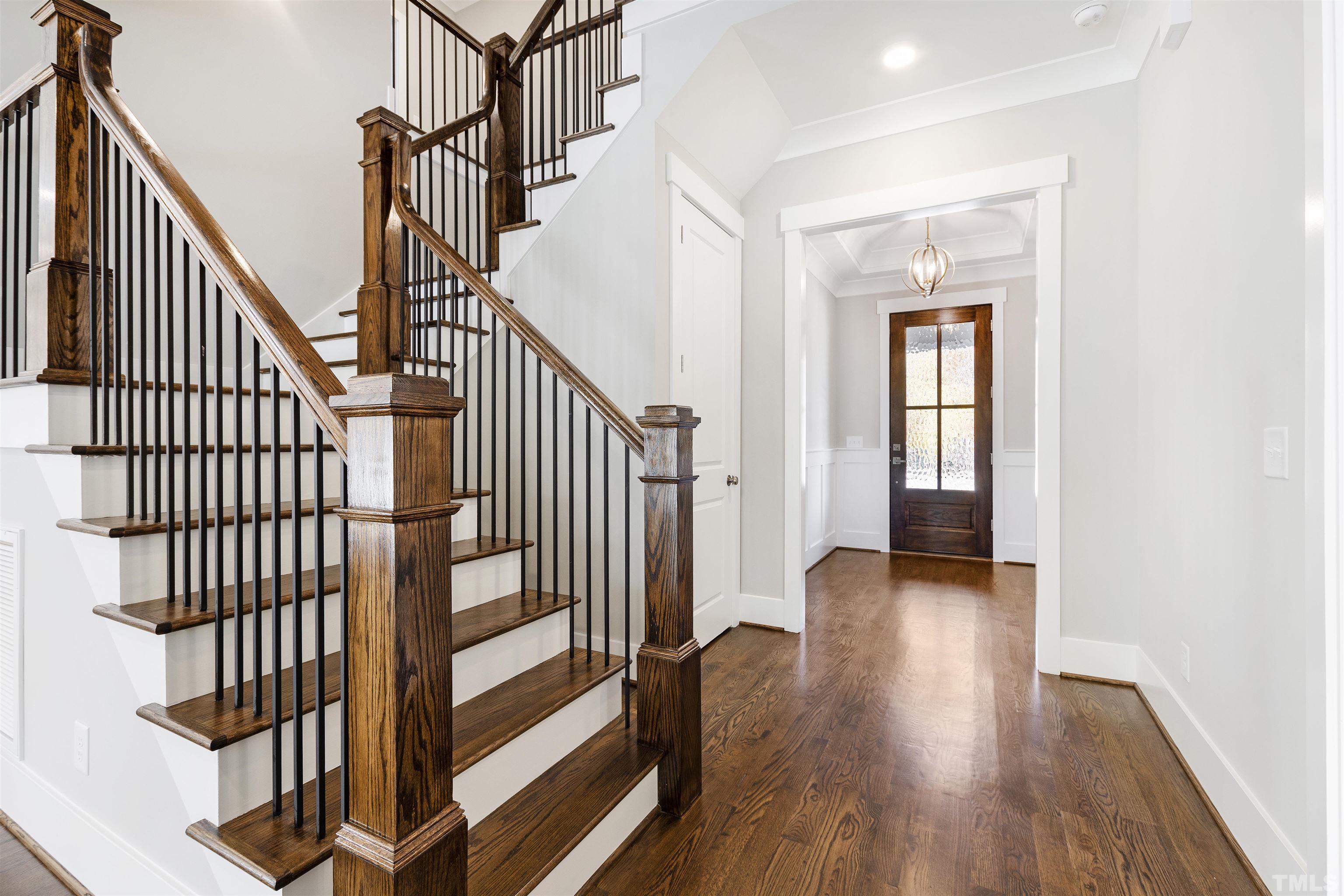 4013 Wilton Woods Place Cary, NC 27519 - Photo 8 of 30 a view of staircase with white walls and a window