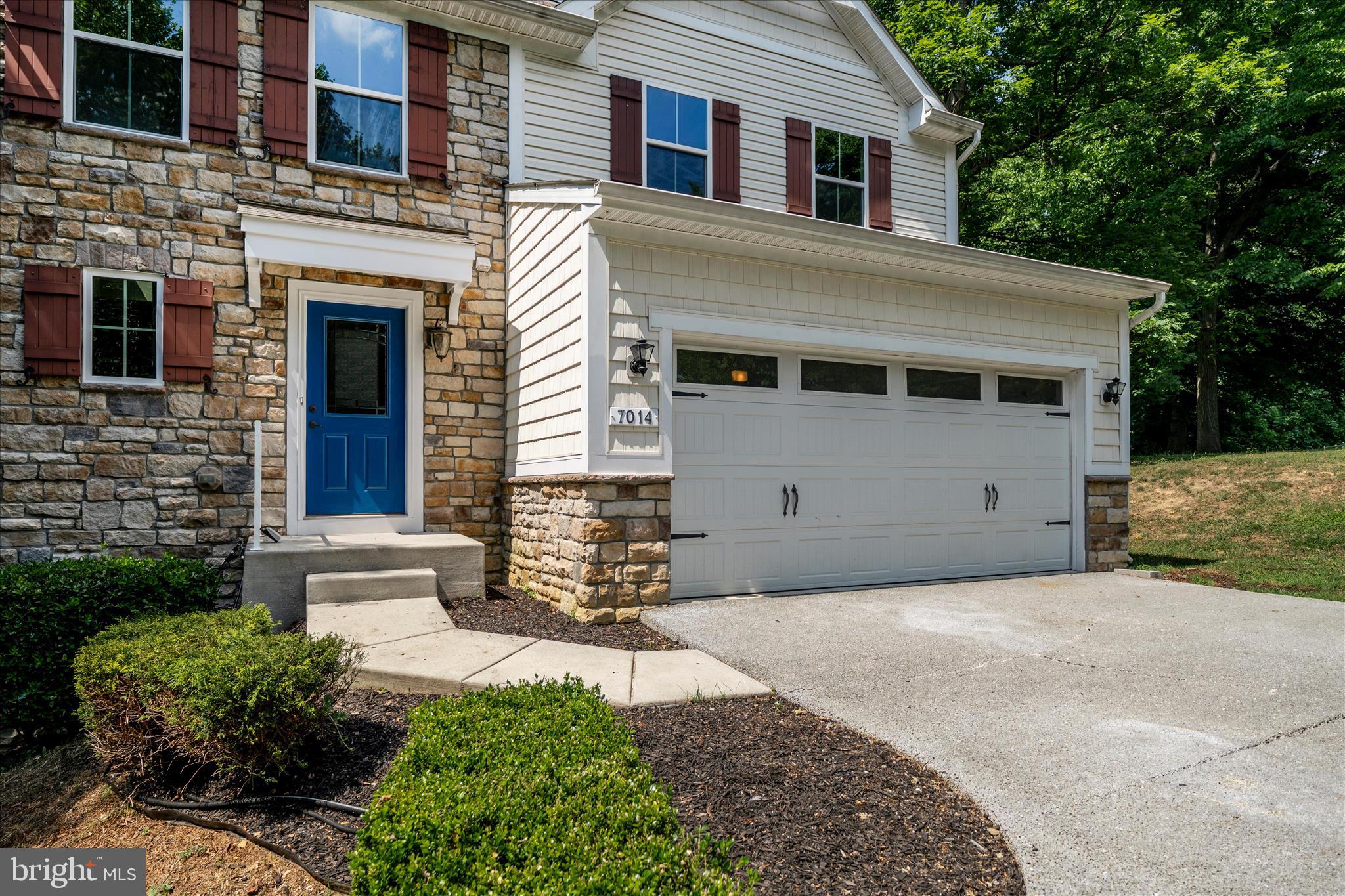 7014 Linden Avenue Elkridge, MD 21075 - Photo 4 of 42 a front view of a house with a yard and garage