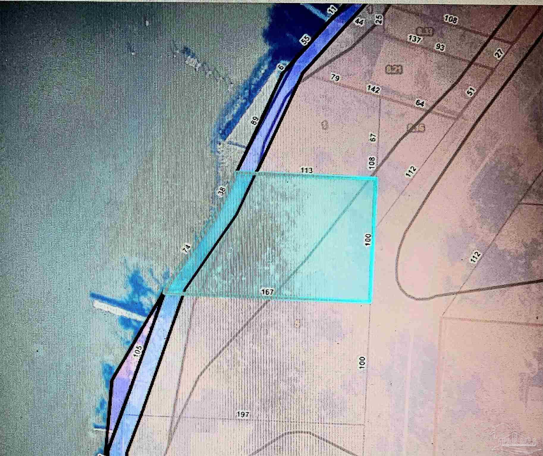 293 Garcon Point Road Milton, FL 32583 - Photo 12 of 12 a picture of a room with wooden floor and windows