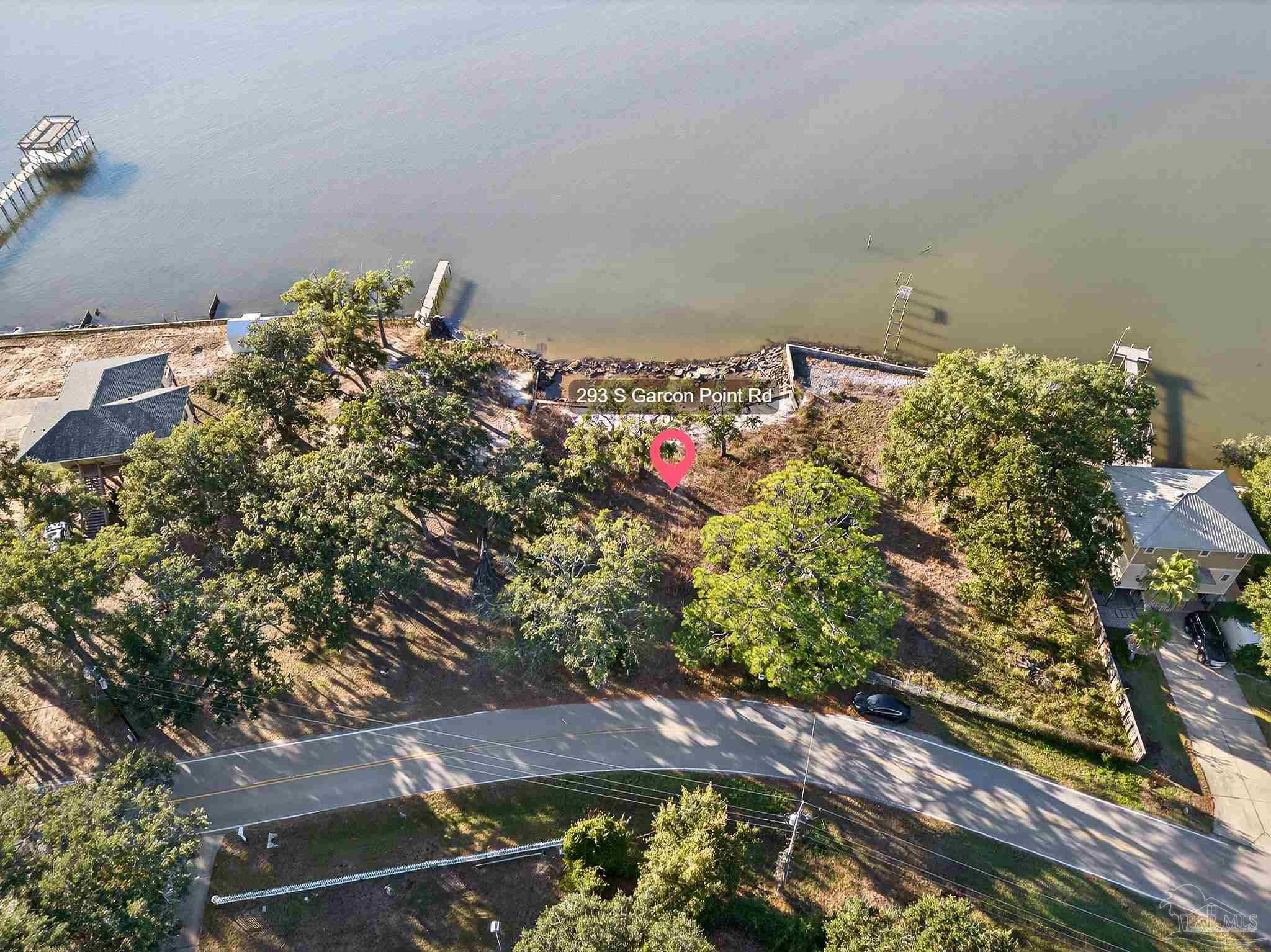 293 Garcon Point Road Milton, FL 32583 - Photo 8 of 12 a view of a houses with a yard