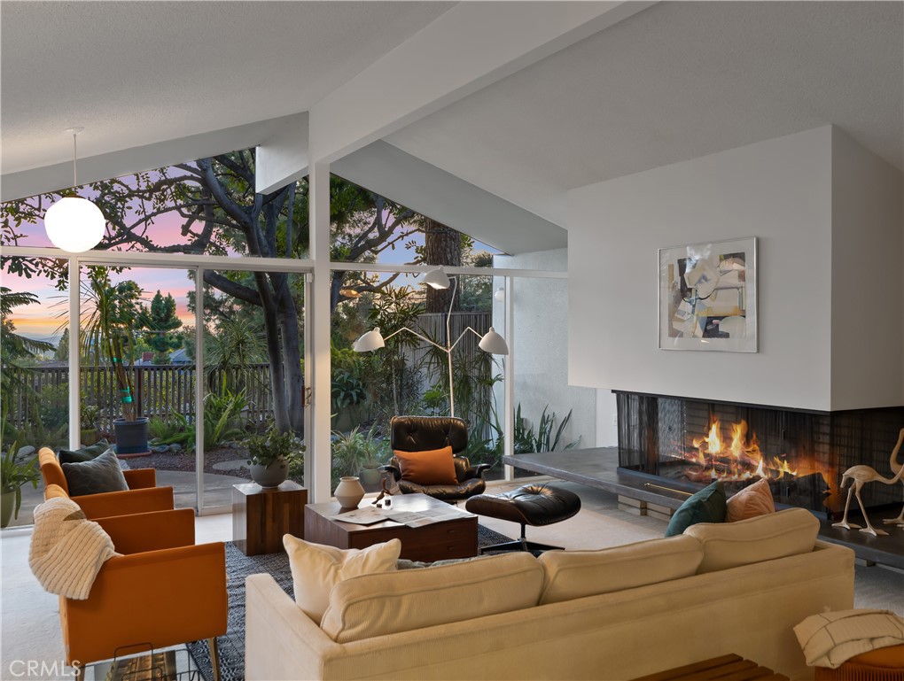 246 Angelo Place Arcadia, CA 91006 - Photo 12 of 72 a living room with furniture fireplace and a large window