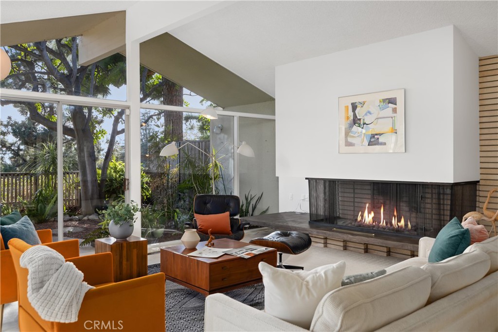 246 Angelo Place Arcadia, CA 91006 - Photo 19 of 72 a living room with furniture and a fireplace