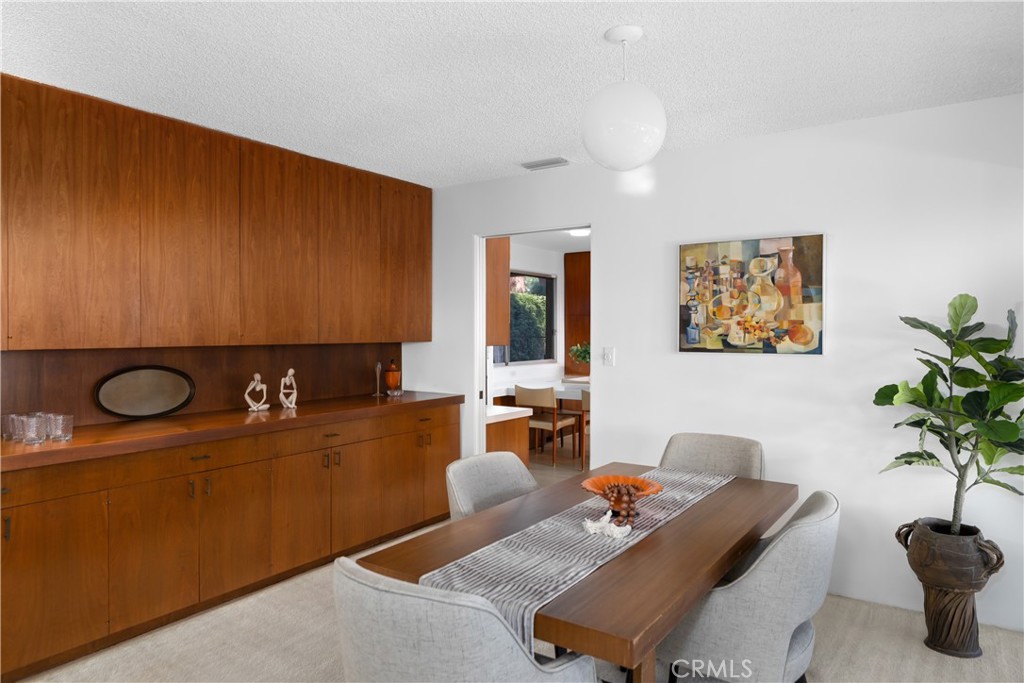 246 Angelo Place Arcadia, CA 91006 - Photo 26 of 72 a dining room with furniture and potted plant