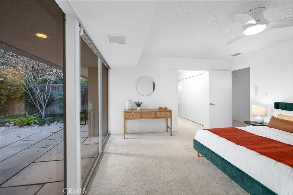 246 Angelo Place Arcadia, CA 91006 - Photo 36 of 72 a bedroom with a bed and a chandelier