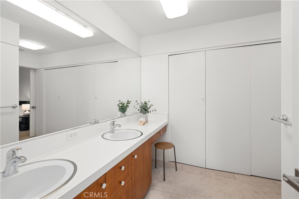 246 Angelo Place Arcadia, CA 91006 - Photo 40 of 72 a bathroom with a granite countertop sink and a mirror