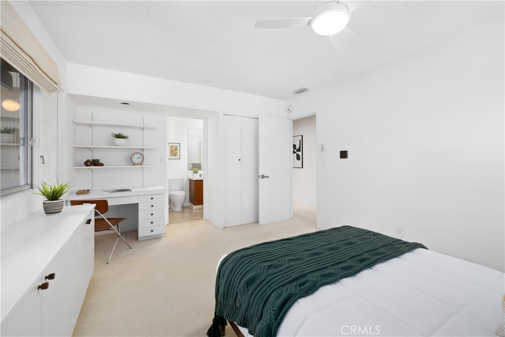 246 Angelo Place Arcadia, CA 91006 - Photo 45 of 72 a bedroom with a bed and a table in it