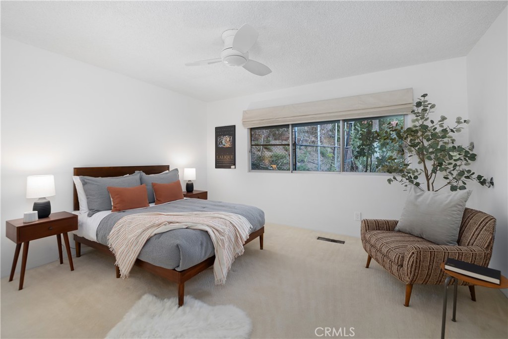 246 Angelo Place Arcadia, CA 91006 - Photo 48 of 72 a spacious bedroom with a bed and a couch