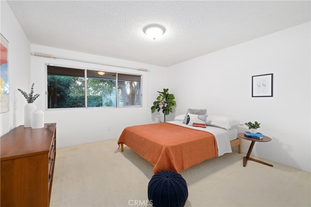 246 Angelo Place Arcadia, CA 91006 - Photo 51 of 72 a bedroom with a bed and a potted plant