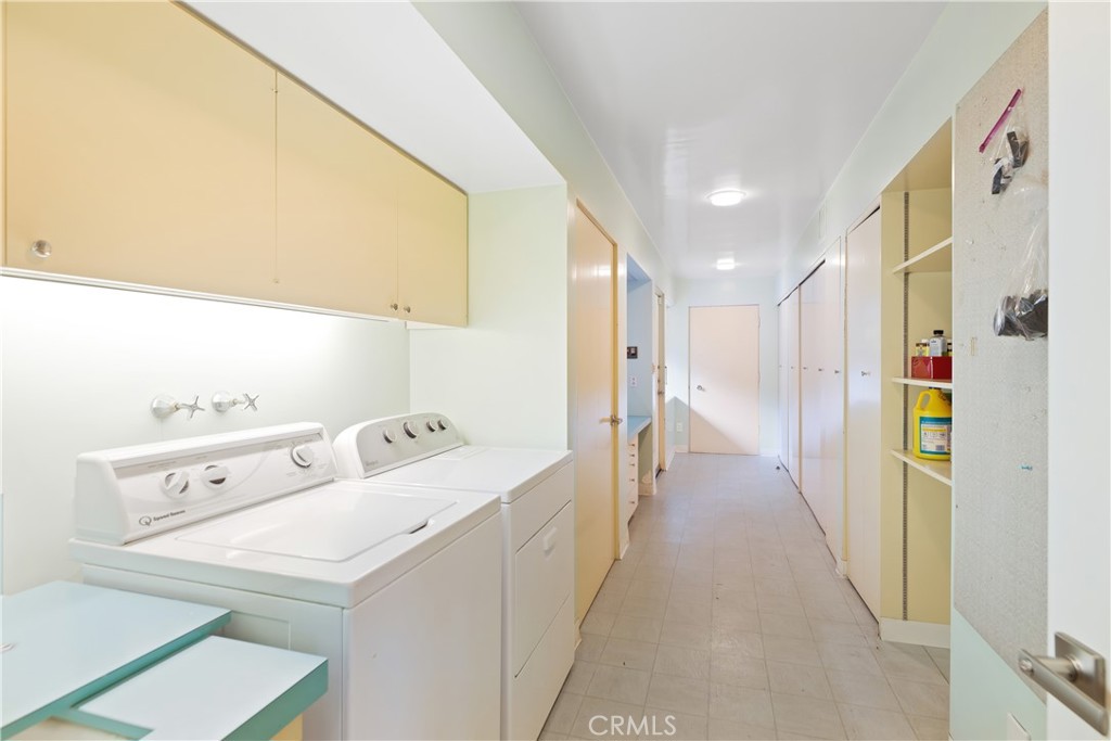 246 Angelo Place Arcadia, CA 91006 - Photo 53 of 72 a view of washer and dryer with kitchen in the background