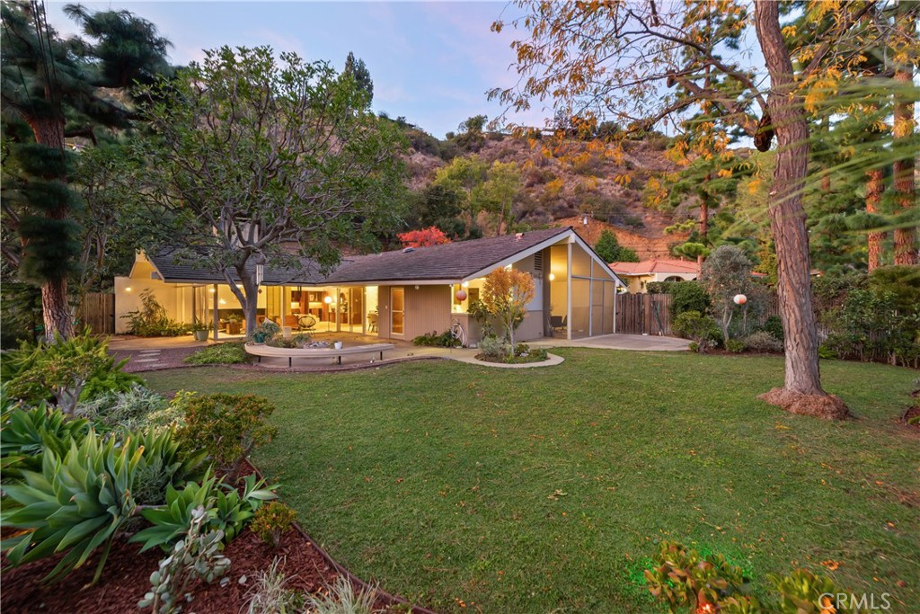 246 Angelo Place Arcadia, CA 91006 - Photo 59 of 72 a house with green field in front of it