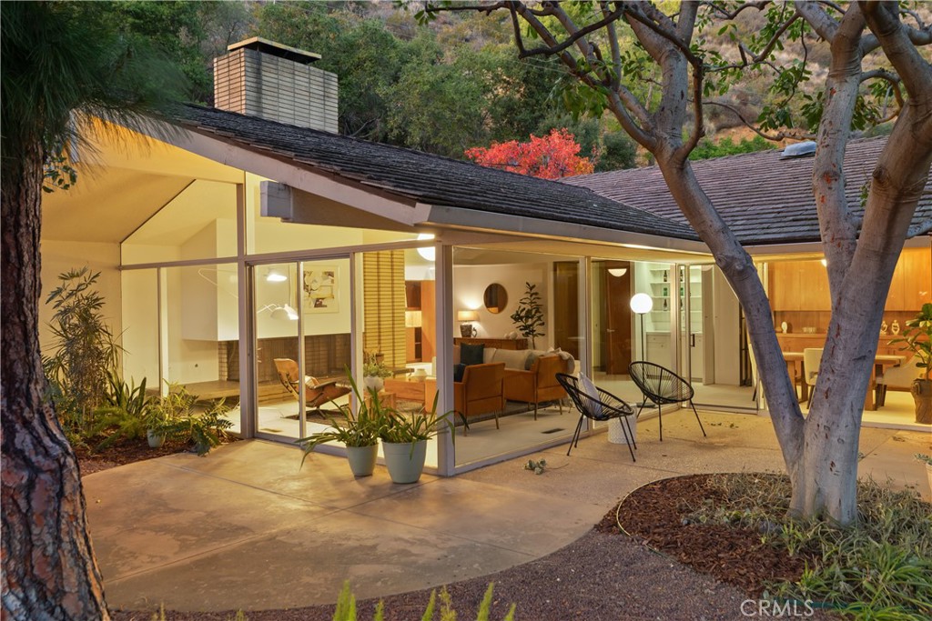 246 Angelo Place Arcadia, CA 91006 - Photo 64 of 72 a view of a patio with table and chairs potted plants and large tree