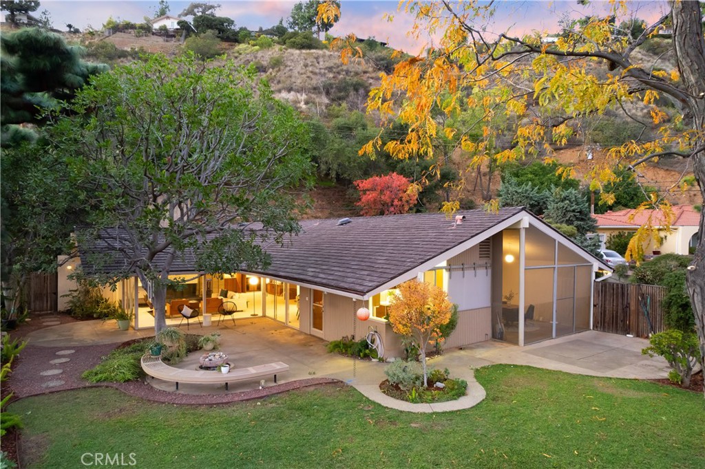 246 Angelo Place Arcadia, CA 91006 - Photo 71 of 72 a front view of a house with a yard fire pit and outdoor seating