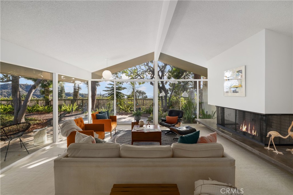 246 Angelo Place Arcadia, CA 91006 - Photo 8 of 72 a living room with furniture large windows and outer view