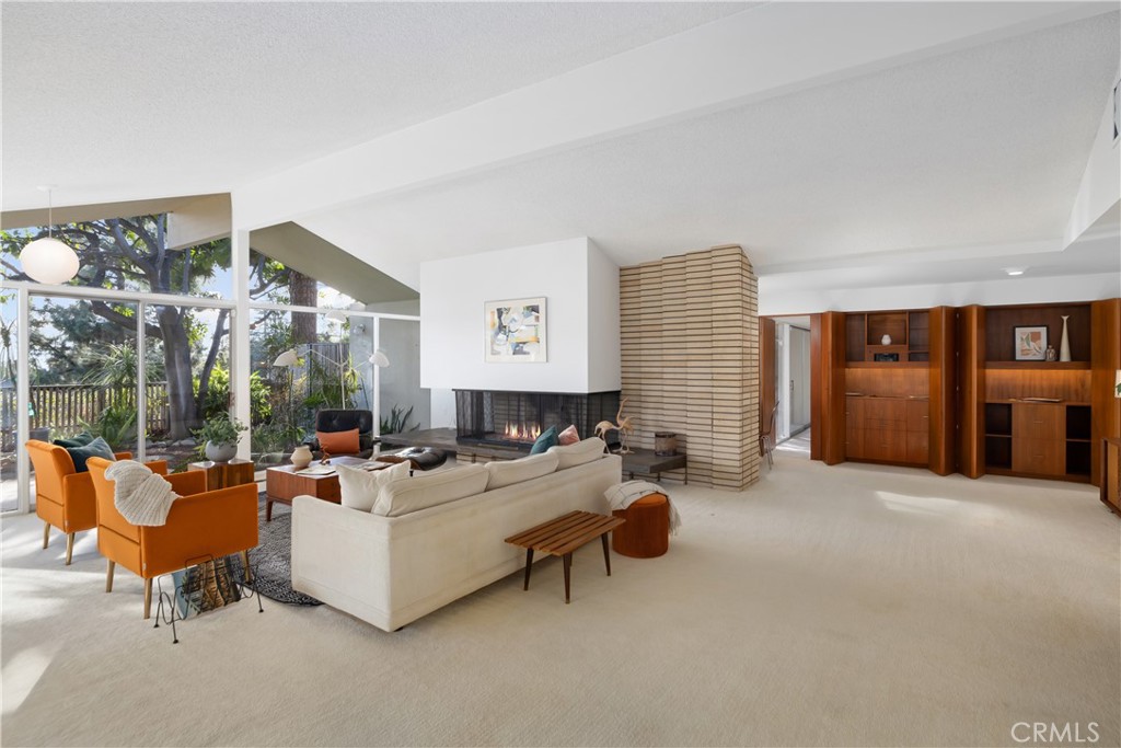 246 Angelo Place Arcadia, CA 91006 - Photo 10 of 72 a living room with furniture and a fireplace
