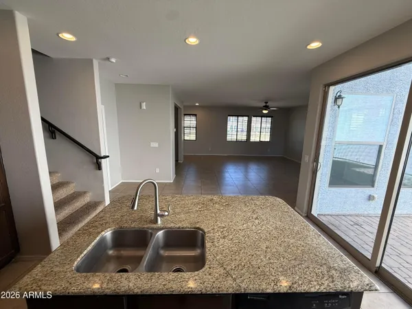a bathroom with mirror sink and window