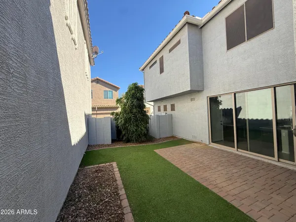 a backyard of a house with garden