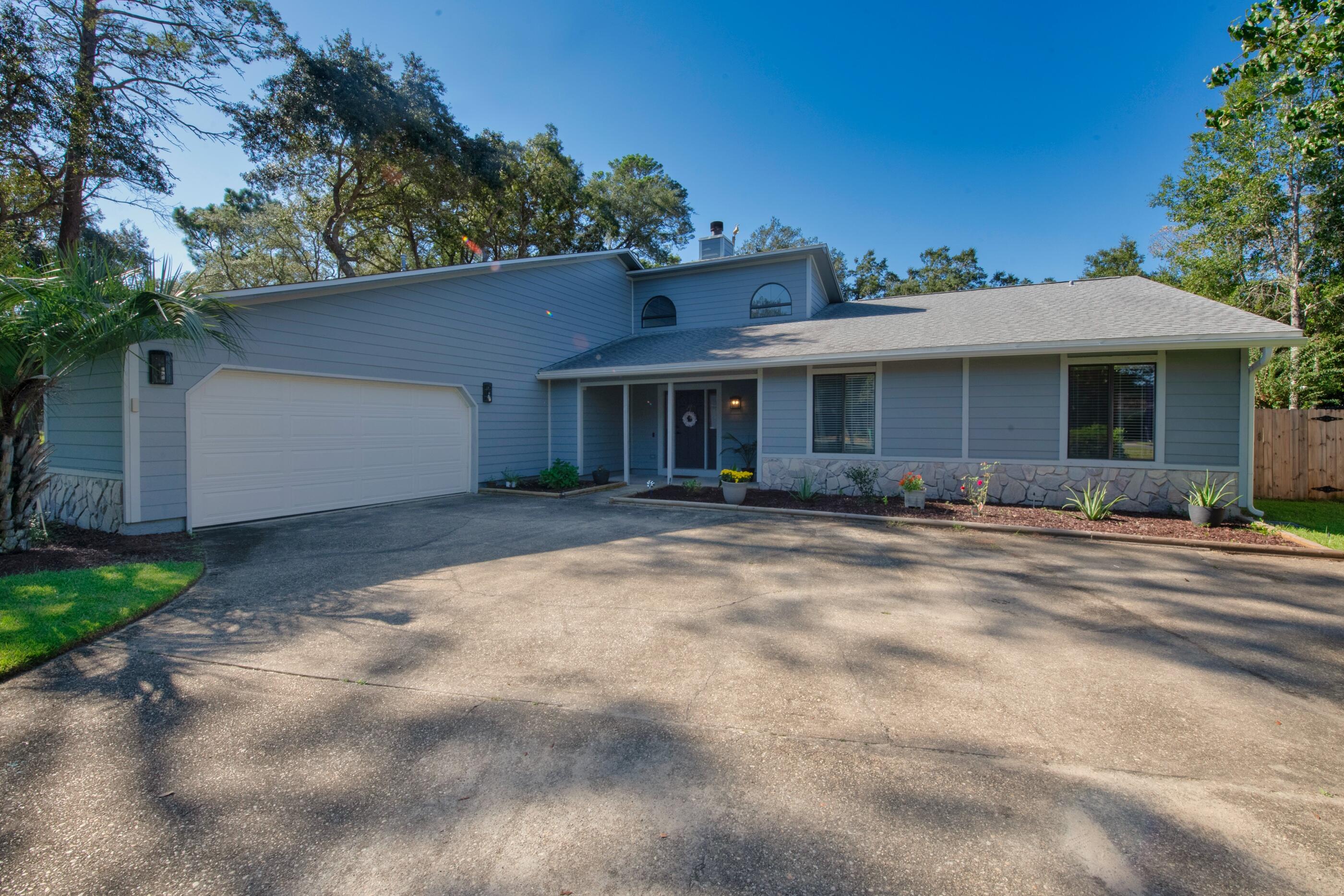 a front view of a house with yard