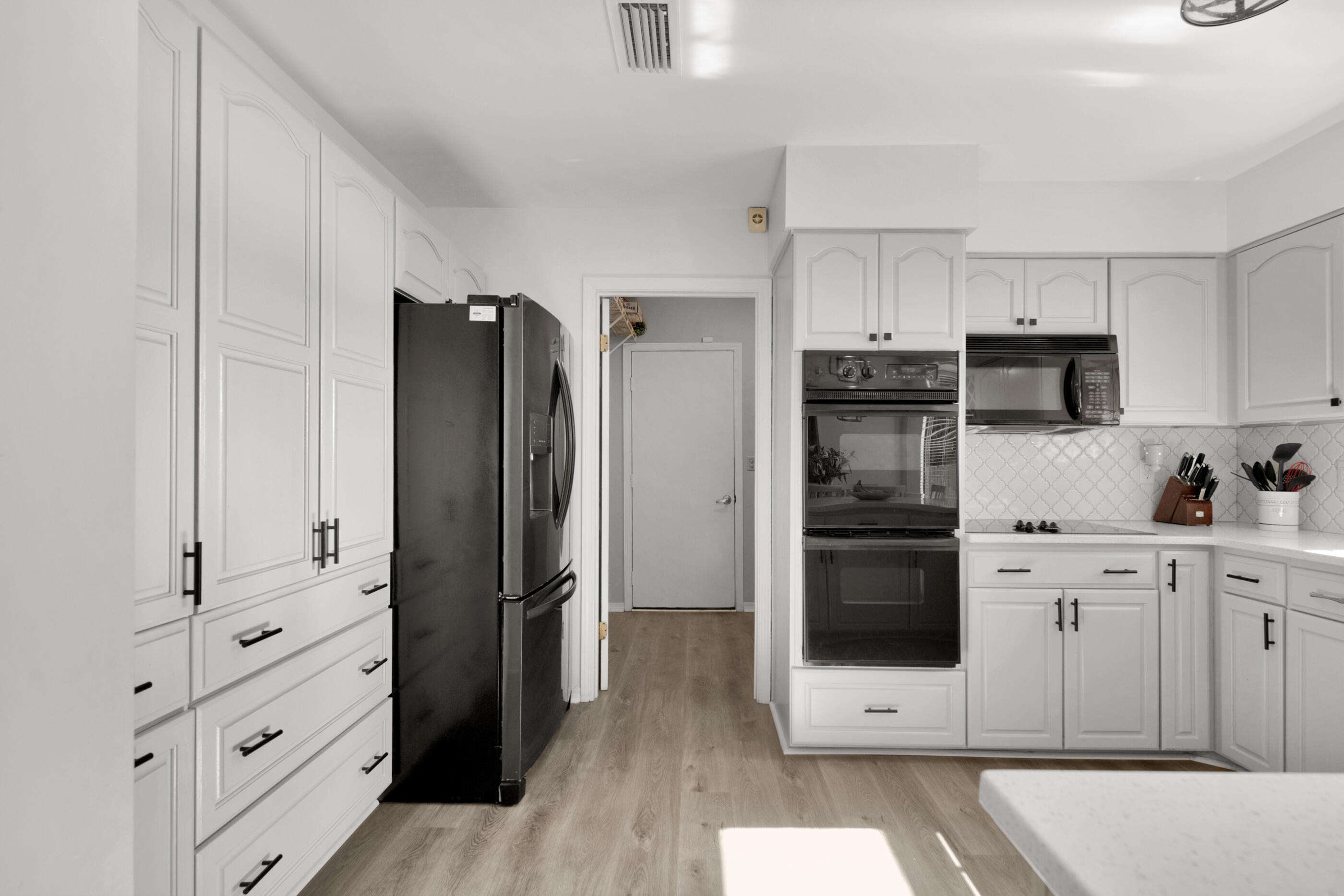 708 Caribbean Way Niceville, FL 32578 - Photo 14 of 42 a kitchen with stainless steel appliances a refrigerator stove and cabinets