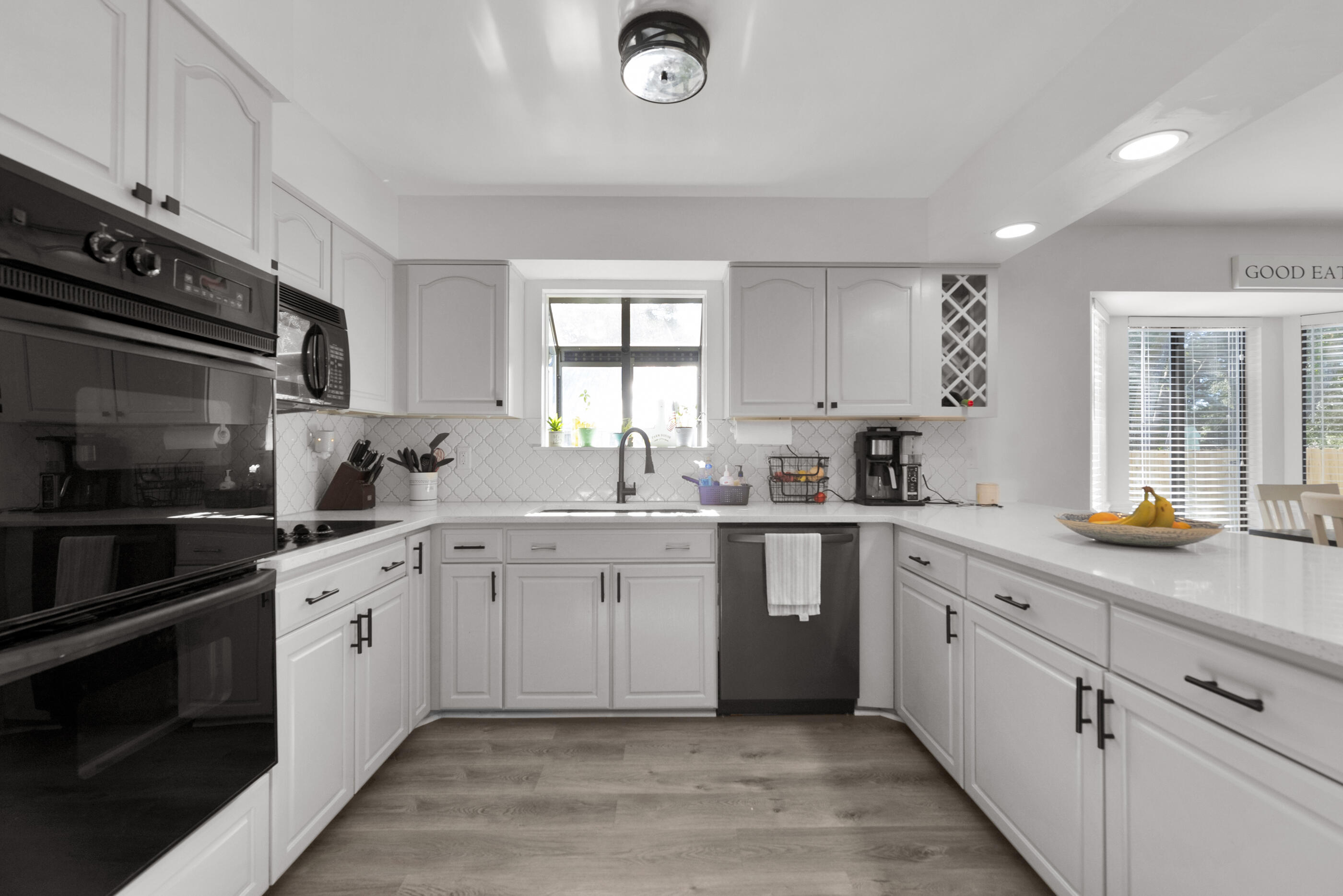 708 Caribbean Way Niceville, FL 32578 - Photo 16 of 42 a kitchen with a sink cabinets and window