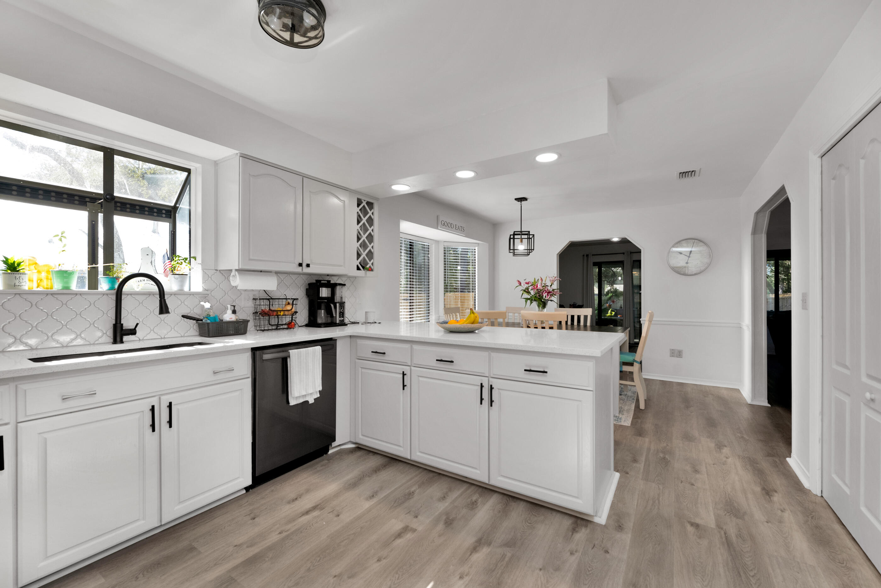 708 Caribbean Way Niceville, FL 32578 - Photo 17 of 42 a kitchen with sink and cabinets