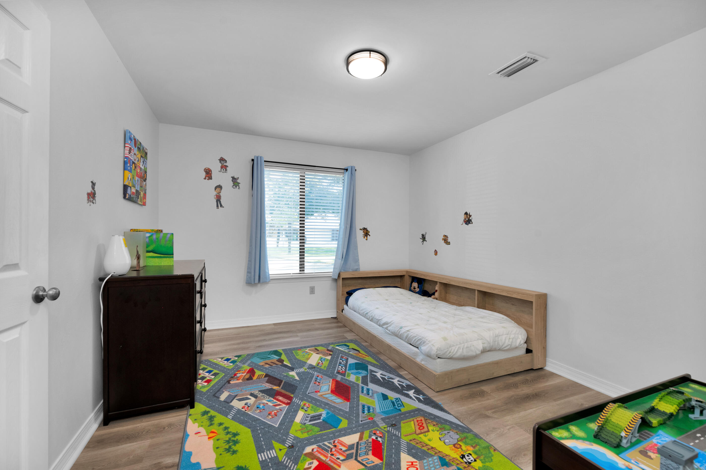 708 Caribbean Way Niceville, FL 32578 - Photo 22 of 42 a bedroom with a bed and a window