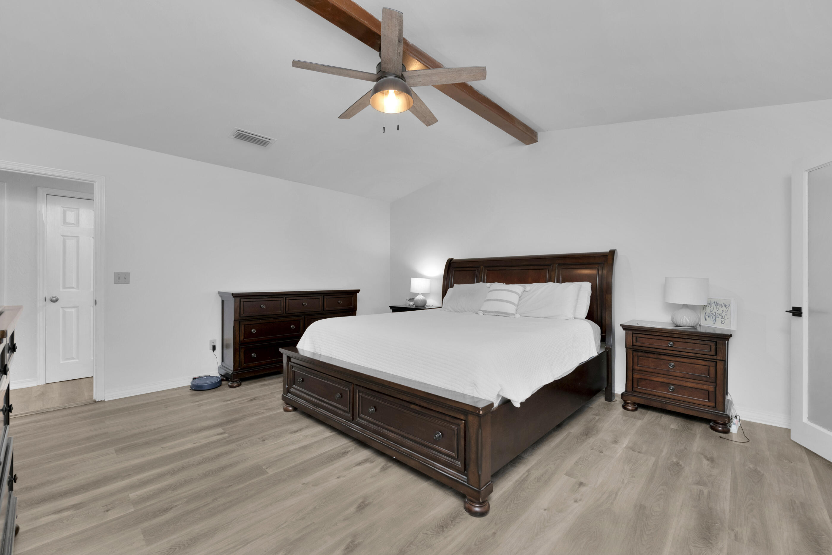 708 Caribbean Way Niceville, FL 32578 - Photo 27 of 42 a bed room with a bed and a ceiling fan