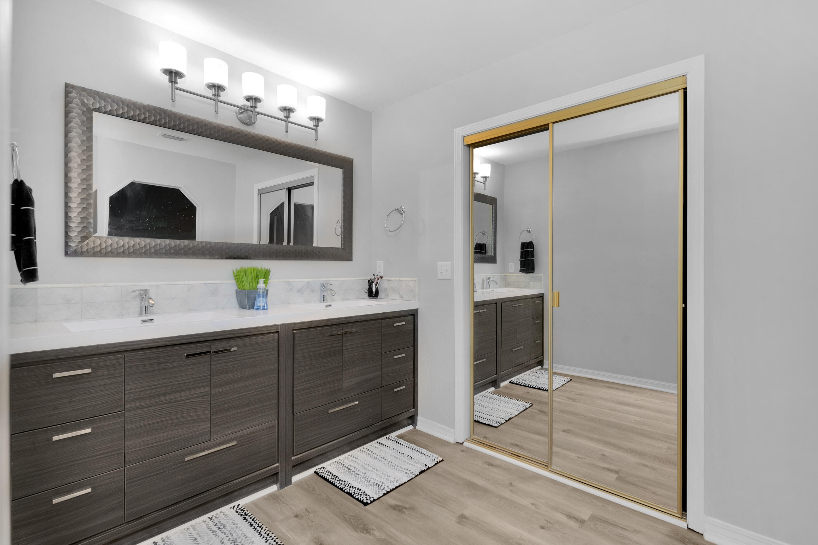 708 Caribbean Way Niceville, FL 32578 - Photo 32 of 42 a spacious bathroom with a double vanity sink and a mirror