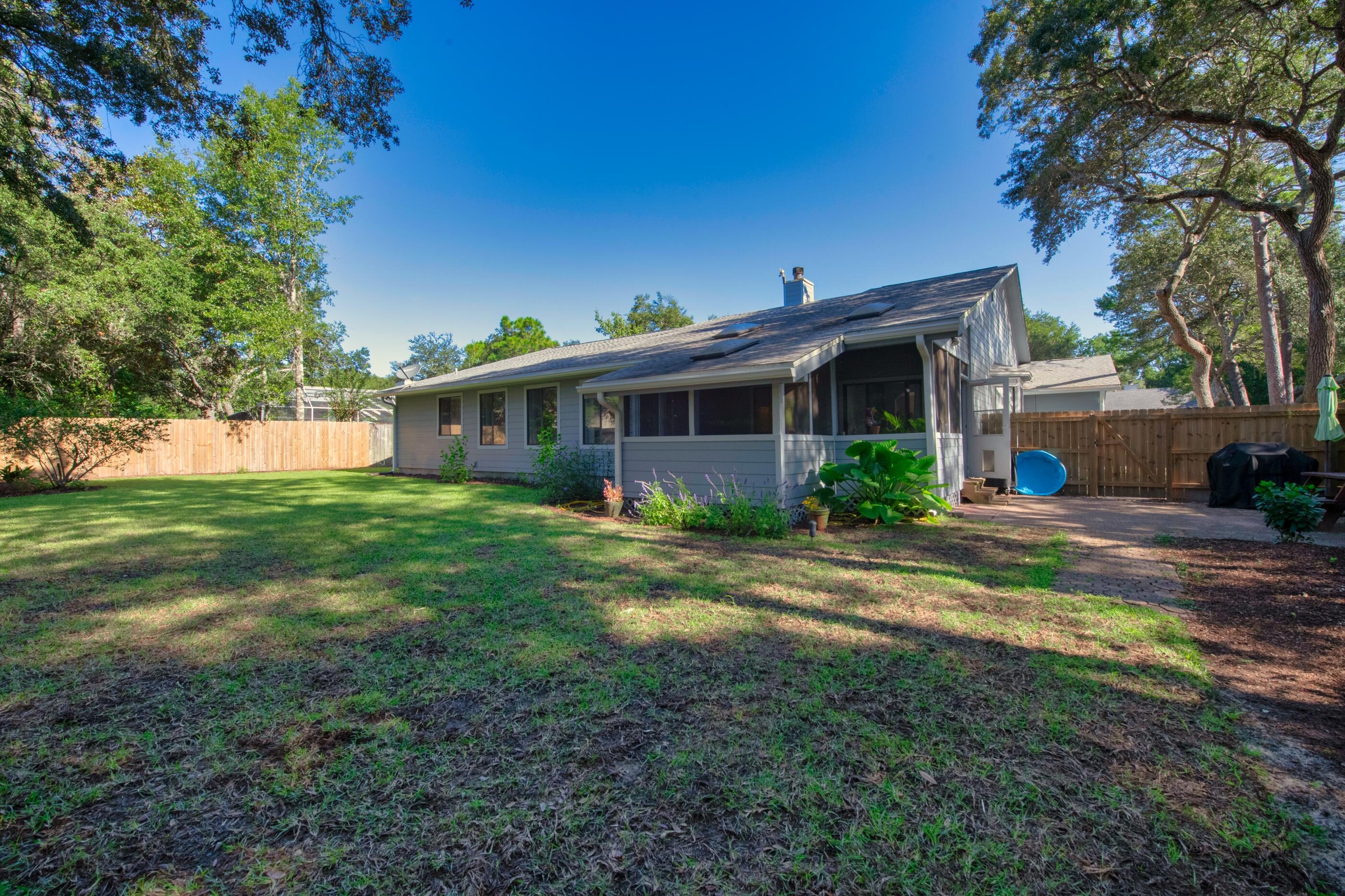708 Caribbean Way Niceville, FL 32578 - Photo 39 of 42 a front view of house with yard and green space