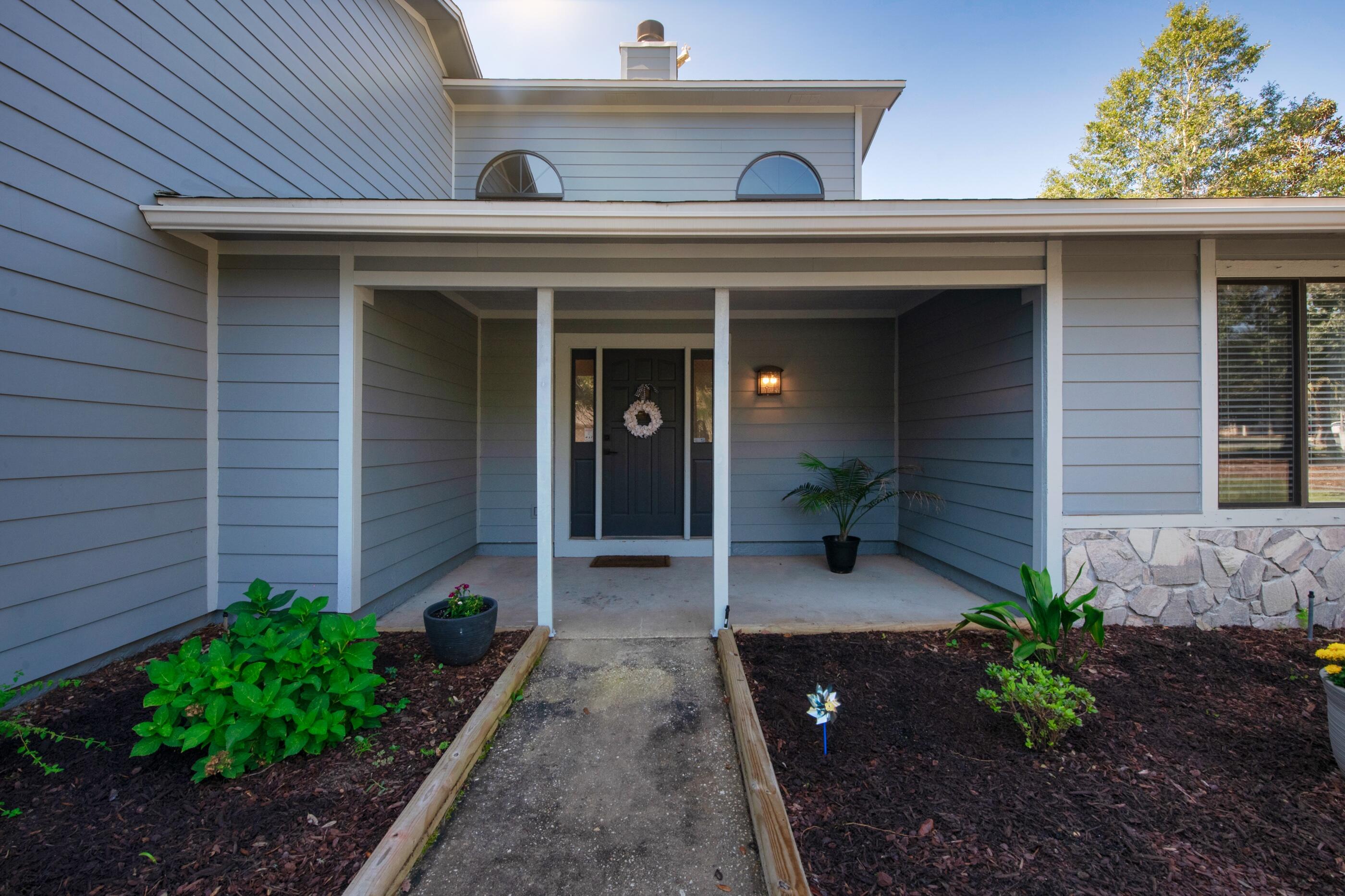 708 Caribbean Way Niceville, FL 32578 - Photo 5 of 42 a view of a pathway of the house