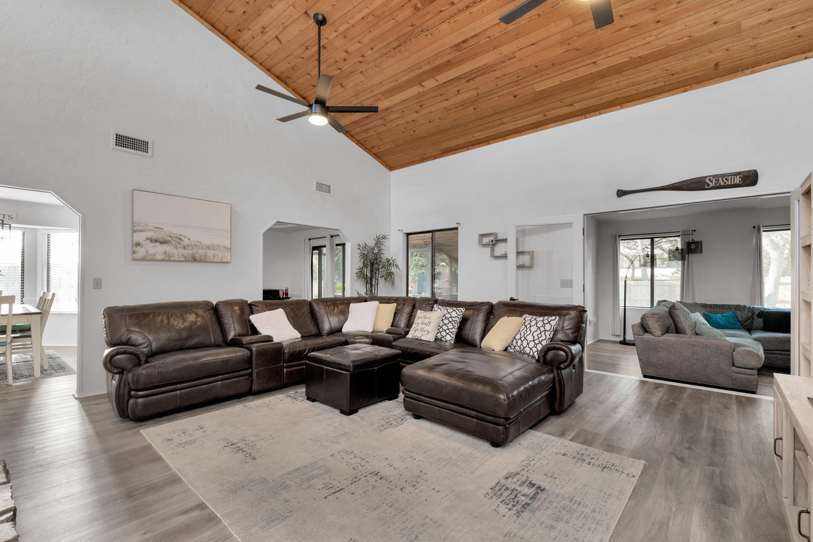 708 Caribbean Way Niceville, FL 32578 - Photo 8 of 42 a living room with furniture a couch and wooden floor