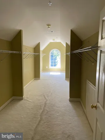 a view of an empty room with large window