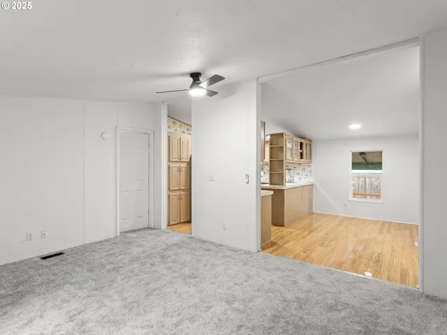 a view of a big room with windows and cabinet