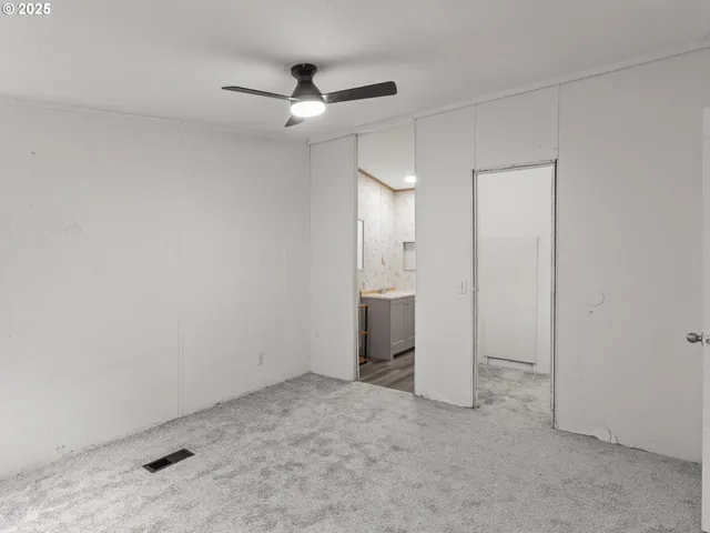 an empty room with a bathroom