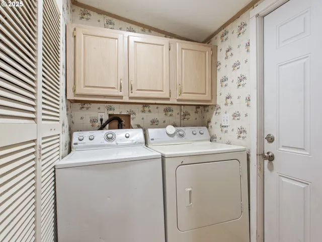 a utility room with dryer and washer