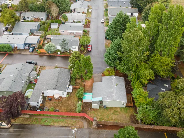 an aerial view of multiple houses with yard