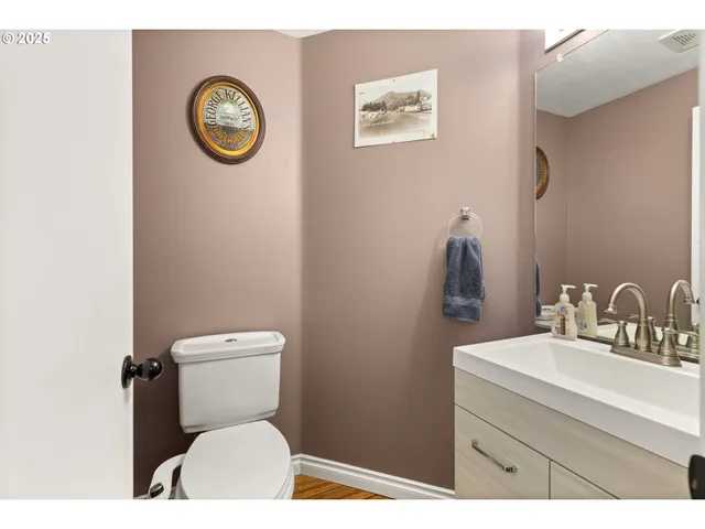 a bathroom with a toilet and a sink