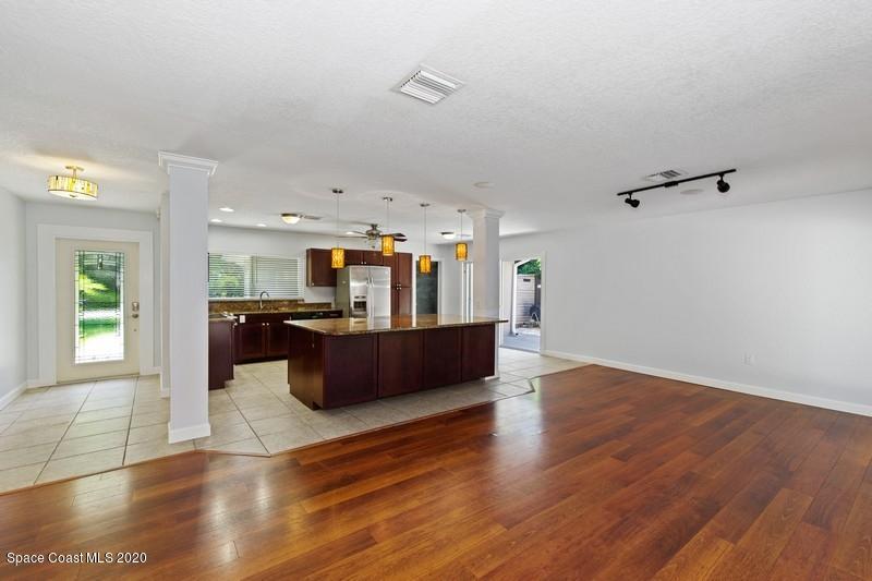 964 Samar Road Cocoa Beach, FL 32931 - Photo 5 of 10 05_964SamarRd_94_FamilyRoomKitchen_FlexM