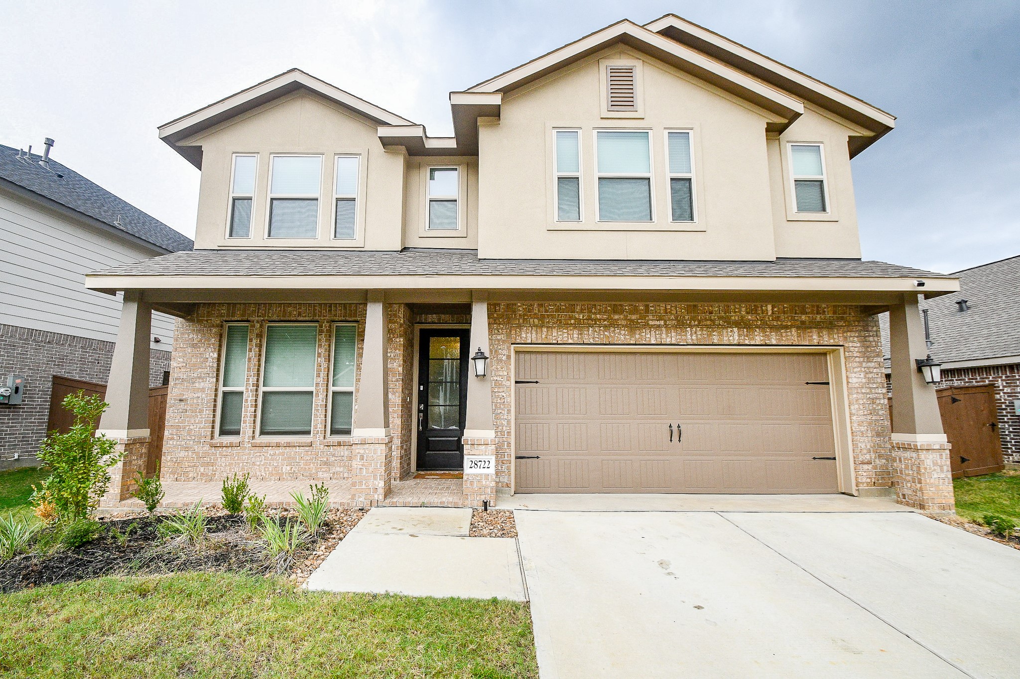 28722 Mount Bonnell Drive New Caney, TX 77357 - Photo 1 of 32 front view of a house with a yard