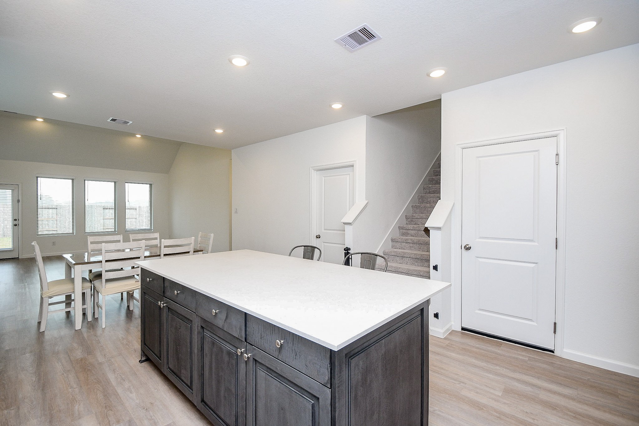 28722 Mount Bonnell Drive New Caney, TX 77357 - Photo 11 of 32 a kitchen with a stove a refrigerator and wooden floor