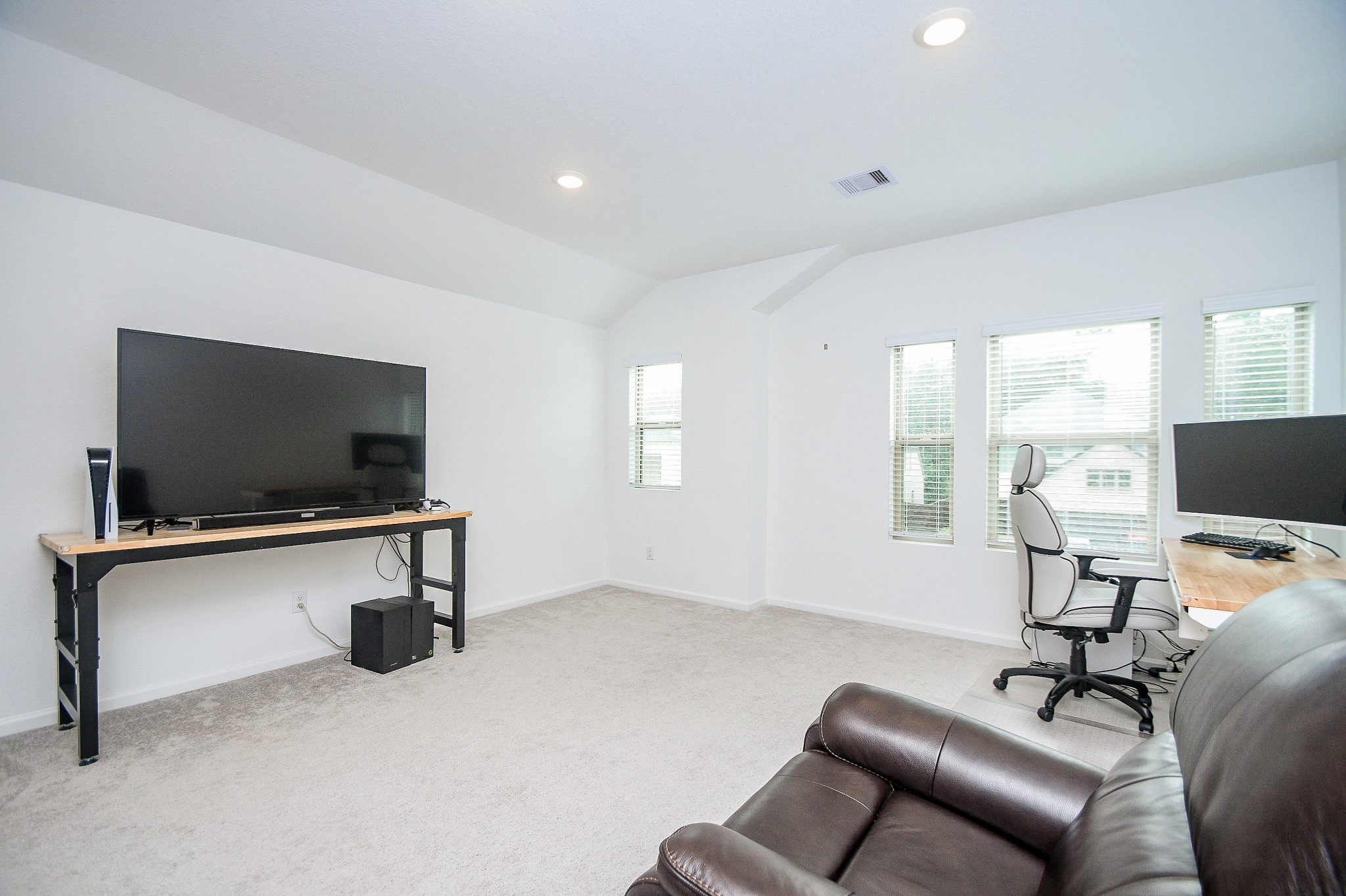 28722 Mount Bonnell Drive New Caney, TX 77357 - Photo 16 of 32 a living room with furniture and a flat screen tv