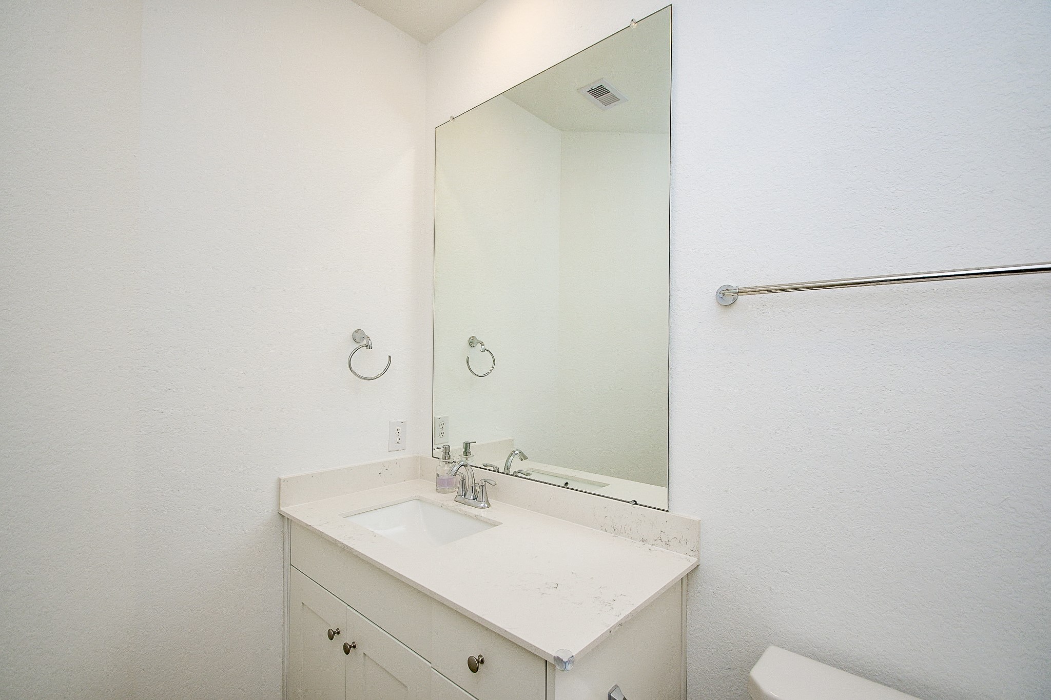 28722 Mount Bonnell Drive New Caney, TX 77357 - Photo 17 of 32 a bathroom with a sink and a mirror