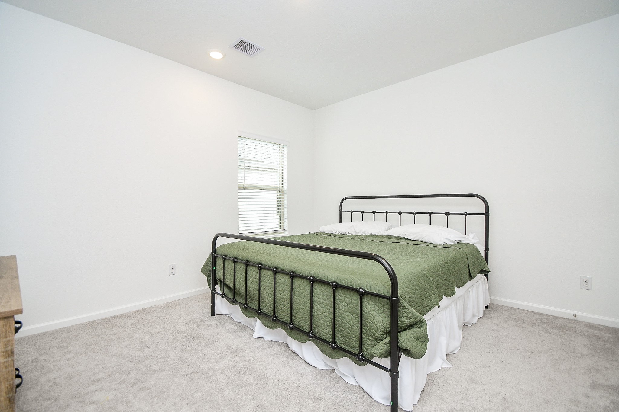 28722 Mount Bonnell Drive New Caney, TX 77357 - Photo 19 of 32 a bedroom with a bed and a window